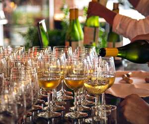 Pouring chardonnay for a catered event